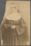Sister M. Rose in eyeglasses and holding pamphlet