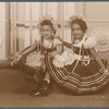 Margarita and Sonia in bric brac dresses in formal portrait