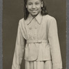 Teresa Roldan in suit dress in formal portrait