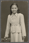 Teresa Roldan in suit dress in formal portrait