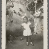 Teresa Roldan in hair bow and hand on hip in formal portrait