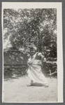 Teresa Roldan, in headwrap, stands with hand on hip