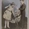 Blackstone performing a flower trick with assistant Inez Nourse