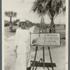 Katherine Bell Tippetts with St. Petersburg Bird Sanctuary sign