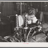 A sewing machine operator at "Levine & Levine" ladies coats who also runs a small farm near Colchester, Connecticut.