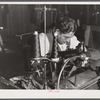 A sewing machine operator at "Levine & Levine" ladies coats who also runs a small farm near Colchester, Connecticut.
