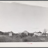 A long "strung out" farm house near Robbinston, Maine.