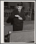 One of the Jewish residents of Colchester, Connecticut after the services in the local synagogue, taking some snuff.