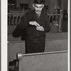 One of the Jewish residents of Colchester, Connecticut after the services in the local synagogue, taking some snuff.