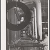 New type of plating machine being used at the Hamilton Standard Propeller Corporation. It automatically dips the part into the proper solutions for the proper lengths of time. East Hartford, Connecticut.