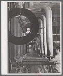 New type of plating machine being used at the Hamilton Standard Propeller Corporation. It automatically dips the part into the proper solutions for the proper lengths of time. East Hartford, Connecticut.