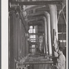 New type of plating machine being used at the Hamilton Standard Propeller Corporation. It automatically dips the part into the proper solutions for the proper length of time. East Hartford, Connecticut.