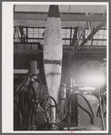 Finishing the base of a rough cut propeller at the Hamilton Standard Propeller Corporation. East Hartford, Connecticut.