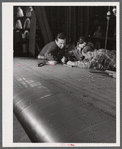 Working on an aileron assembly of a wing at the Vought Sikorsky Aircraft Corporation. Stratford, Connecticut.