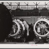 Workmen on the final assembly of a plane at the Vought Sikorsky Aircraft Corporation. Stratford, Connecticut.