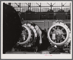 Workmen on the final assembly of a plane at the Vought Sikorsky Aircraft Corporation. Stratford, Connecticut.