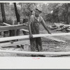 [Black] worker at a small sawmill works in southern Greene County, Georgia