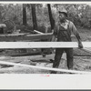 [Black] worker at a small sawmill works in southern Greene County, Georgia