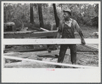[Black] worker at a small sawmill works in southern Greene County, Georgia