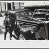 Chauffeur waiting on the main street of Brattleboro, Vermont.