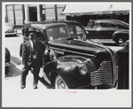 Chauffeur waiting on the main street of Brattleboro, Vermont.