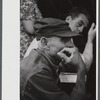 Spectator at an auction in East Albany, Vermont.