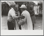 Tintype photographer trying to make a sale at the Champlain Valley Exposition, Essex Junction, Vermont.