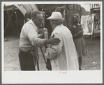 Tintype photographer trying to make a sale at the Champlain Valley Exposition, Essex Junction, Vermont.