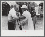 Tintype photographer trying to make a sale at the Champlain Valley Exposition, Essex Junction, Vermont.