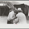 Tintype photographer trying to make a sale at the Champlain Valley Exposition, Essex Junction, Vermont.