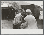 Tintype photographer trying to make a sale at the Champlain Valley Exposition, Essex Junction, Vermont.