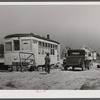 Old street car converted into living quarters for family of four. They were born and raised in Fayetteville, but could not get a place to stay. Husband works at Fort Bragg, North Carolina. Just outside of Fayetteville, North Carolina.