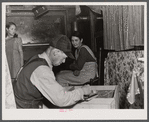 Worker from Fort Bragg and his family living in an old streetcar. He is building for their "new home." Came a hundred miles for this job and expect to move on soon. Near Manchester, North Carolina.