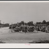 A used car lot adjacent to a trailer settlement of workers from Fort Bragg. Near Fayetteville, North Carolina.