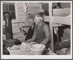 Migratory workers who work at Fort Bragg in bunkhouse where several of them live near Spartanburg, South Carolina.