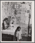 Interior of a one room shack in a settlement of Negro farmers who had moved out of the Santee-Cooper basin. Near Bonneau, South Carolina.