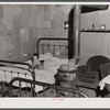 In the home of a "squatter" family that was preparing to move off the Camp Croft area. Near Whitestone, South Carolina.