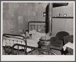In the home of a "squatter" family that was preparing to move off the Camp Croft area. Near Whitestone, South Carolina.