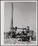 Digging a well for families moving into FSA (Farm Security Administration) prefabricated houses from the Camp Croft area. Pacolet, South Carolina region.