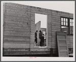 Putting up an inside wall in prefabricated houses for farmers moving out of the Camp Croft area. Pacolet, South Carolina.