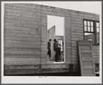 Putting up an inside wall in prefabricated houses for farmers moving out of the Camp Croft area. Pacolet, South Carolina.