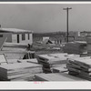 Building prefabricated houses for farmers who had to move out of the Camp Croft area. "Ready made" sections are in foreground. Pacolet, South Carolina region.