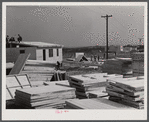 Building prefabricated houses for farmers who had to move out of the Camp Croft area. "Ready made" sections are in foreground. Pacolet, South Carolina region.