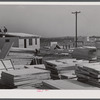 Building prefabricated houses for farmers who had to move out of the Camp Croft area. "Ready made" sections are in foreground. Pacolet, South Carolina region.