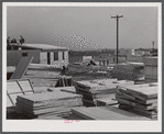 Building prefabricated houses for farmers who had to move out of the Camp Croft area. "Ready made" sections are in foreground. Pacolet, South Carolina region.