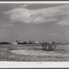 Building porch on prefabricated houses to be used to house some of the farmers that had to move out of Camp Croft area. Pacolet, South Carolina
