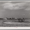 Building porch on prefabricated houses to be used to house some of the farmers that had to move out of Camp Croft area. Pacolet, South Carolina