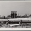 The first walls go up after the foundation has been built on prefabricated houses built by FSA (Farm Security Administration) to house some of the farmers who had to move out of the Camp Croft area region.