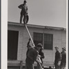 Putting the roof on a prefabricated house at the FSA (Farm Security Administration) project. Pacolet, South Carolina.