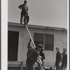 Putting the roof on a prefabricated house at the FSA (Farm Security Administration) project. Pacolet, South Carolina.